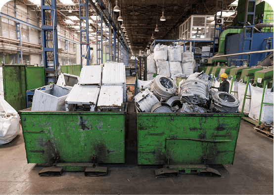 Factory interior with discarded metal parts.