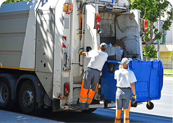 Workers emptying a blue bin