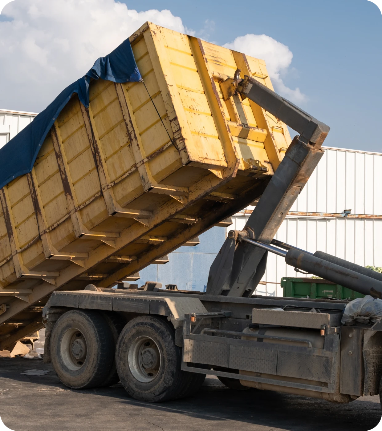 Industrial truck with elevated container
